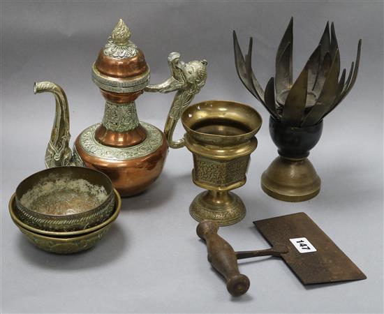 A collection of Indian and Tibetan brassware including a lotus shaped incense burner and a Tibetan teapot tallest 25cm